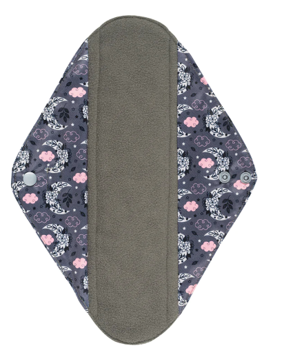 Inside of a reusable Sanitary Pad with a black background and a white and pink moon and cloud design on it and showing the black absorbent inner.
