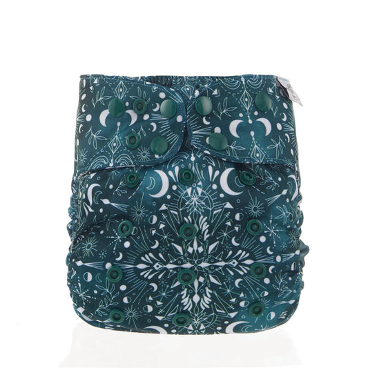 Reusable cloth nappy with a green, moon print.
