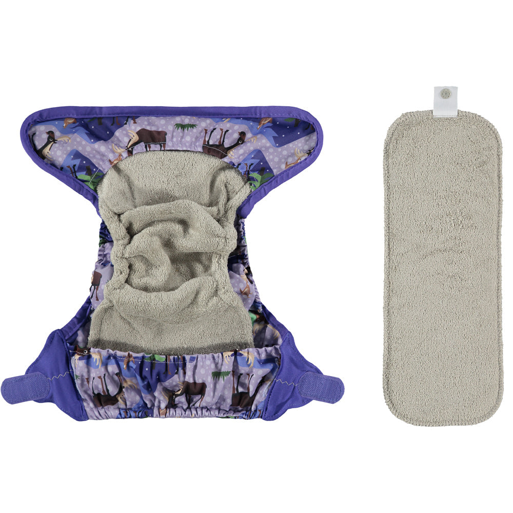 Image showing the inside of a reusable cloth nappy. The booster is already placed inside the nappy and the additional booster is outside of the nappy currently. 