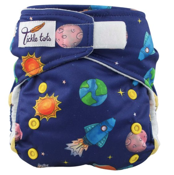 Reusable cloth nappy with velcro fastening and a space pattern. 