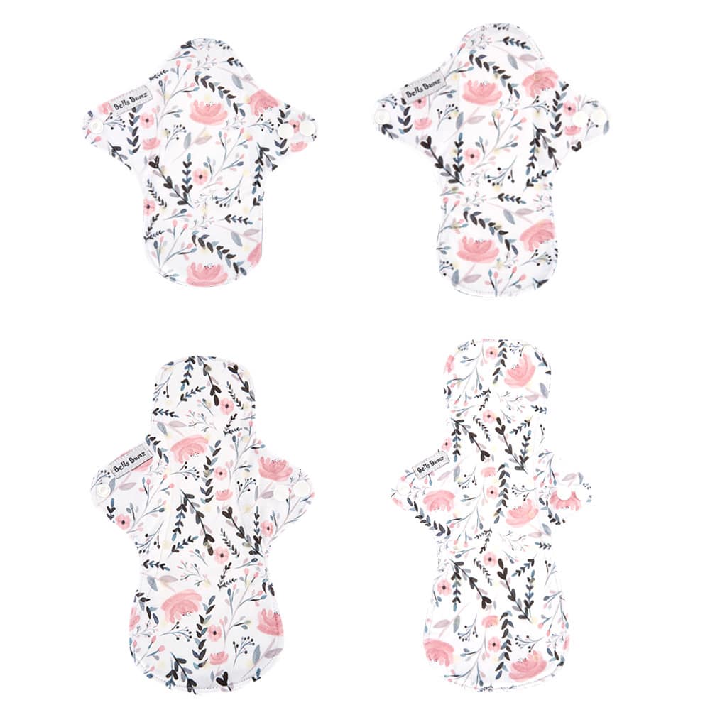 Image shows the PUL patterned side of 4 different reusable sanitary pads. 