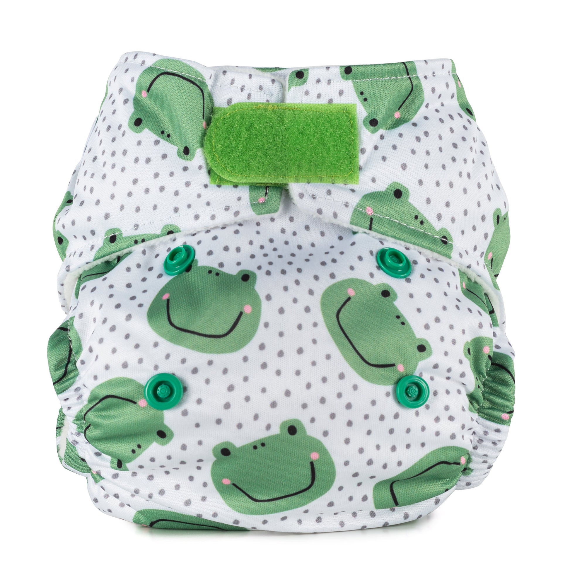 A newborn size reusable cloth nappy with a white background, green frog pattern and velcro fastening. 