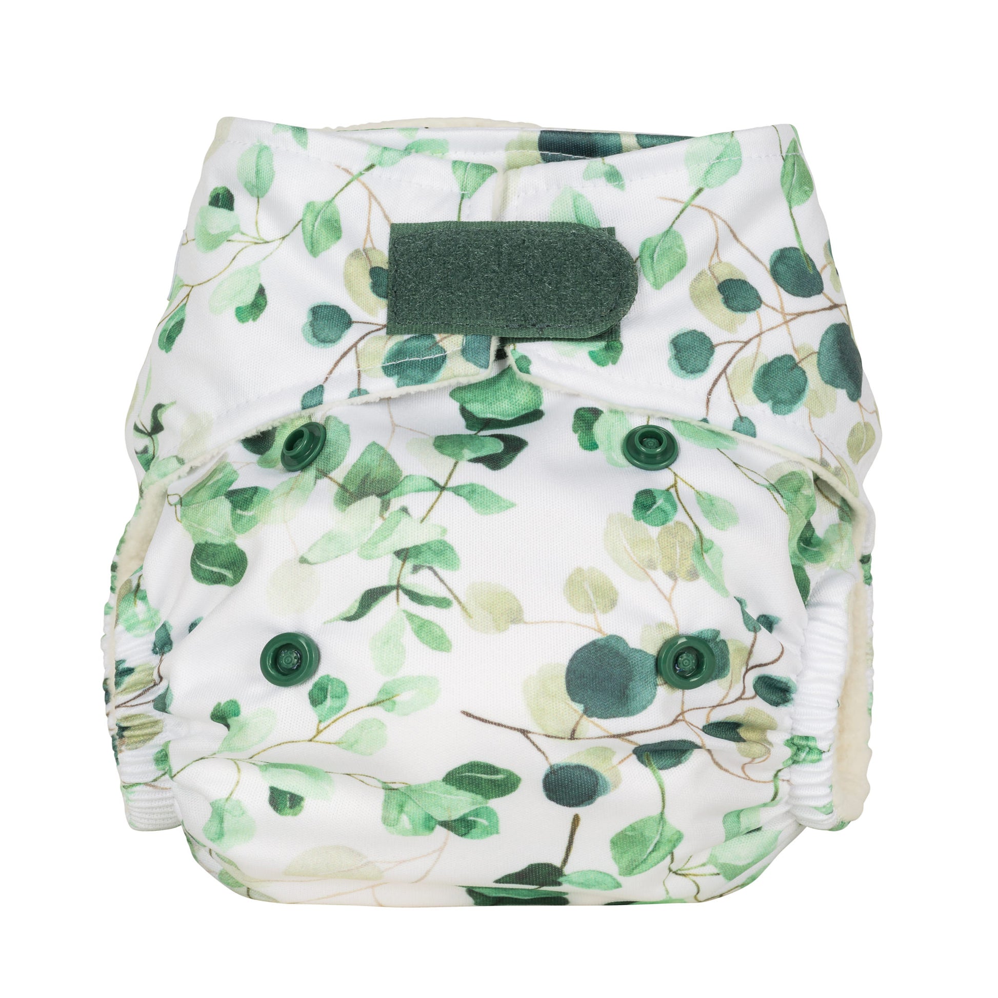 A newborn reusable cloth nappy with a white background and green eucalyptus leaves printed on it. The nappy features a velcro fastening. 