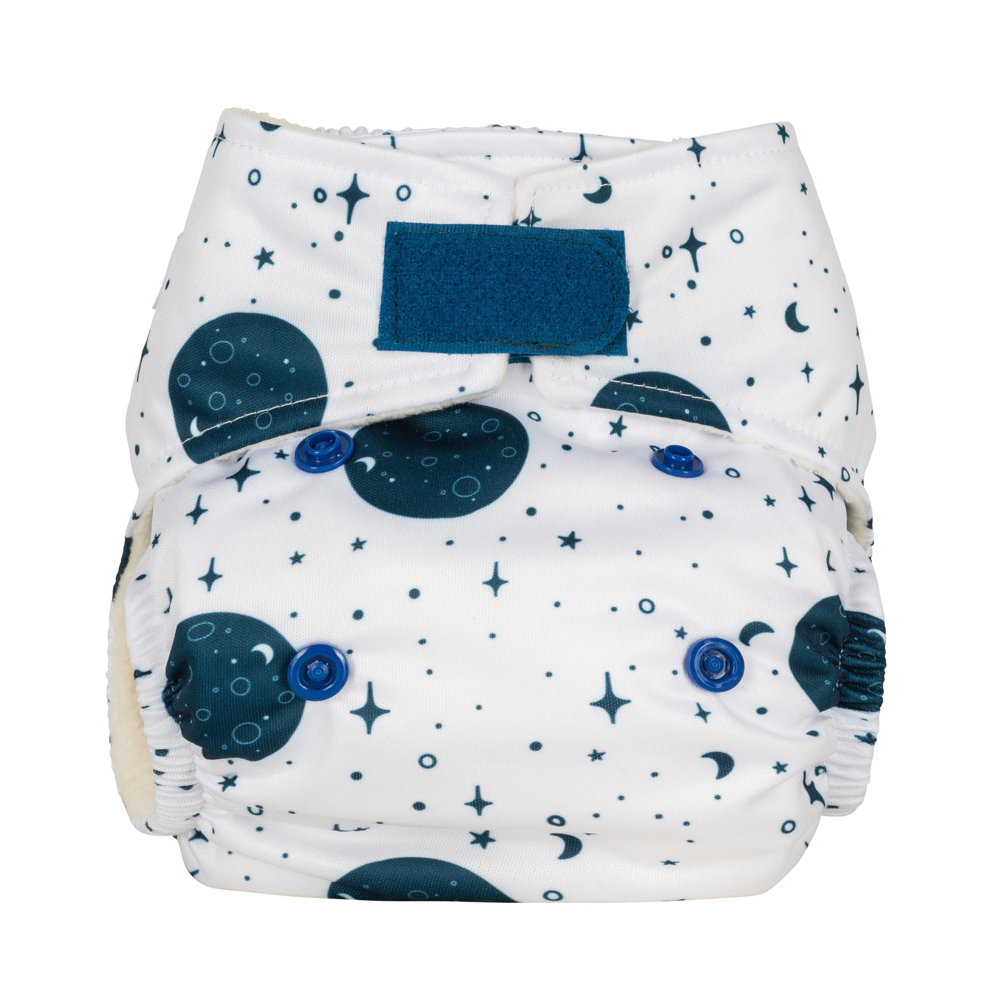 A newborn size reusable cloth nappy with a white background and dark blue moon and stars print. It also features a velcro fastening. 