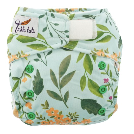 Reusable cloth nappy with velco fastening and leaf print.