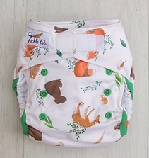 Reusable cloth nappy with a woodland animal theme and velcro fastening. 