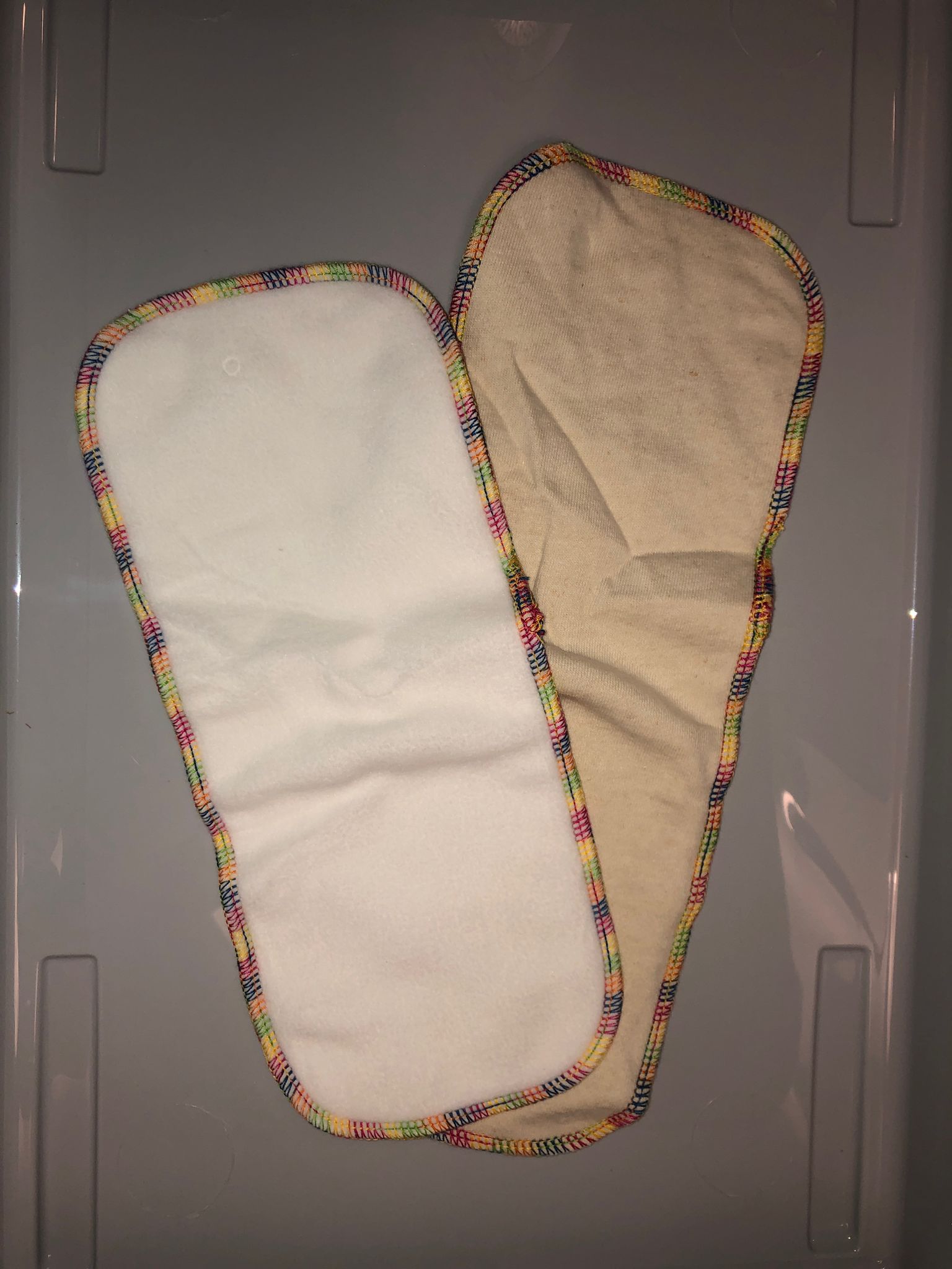 An image showing the two boosters that come with the nappy. 