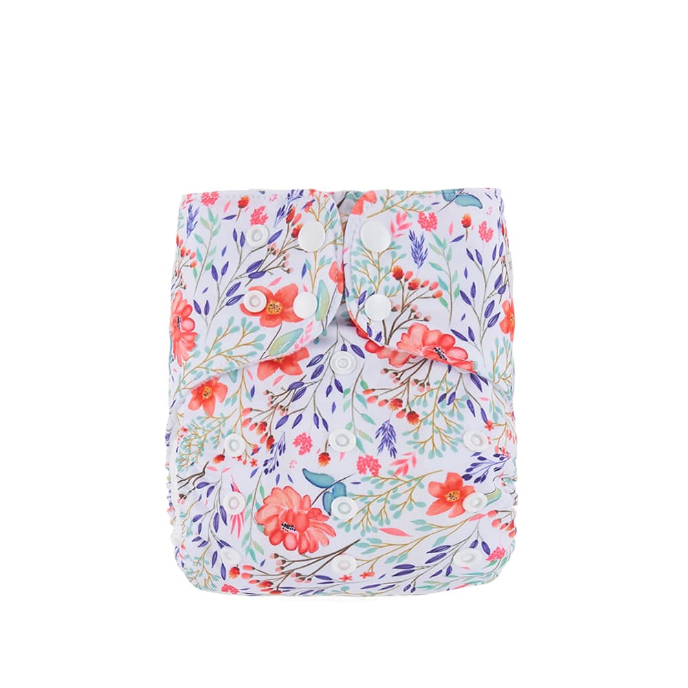 Reusable cloth nappy showing a pink and blue flower pattern.
